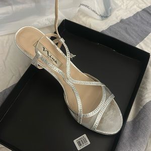 Silver high heel shoe size 9 in women’s. Only worn once!